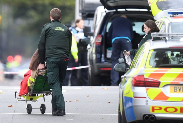 A woman is treated by emergency services at the scene on Cromwell Gardens in London