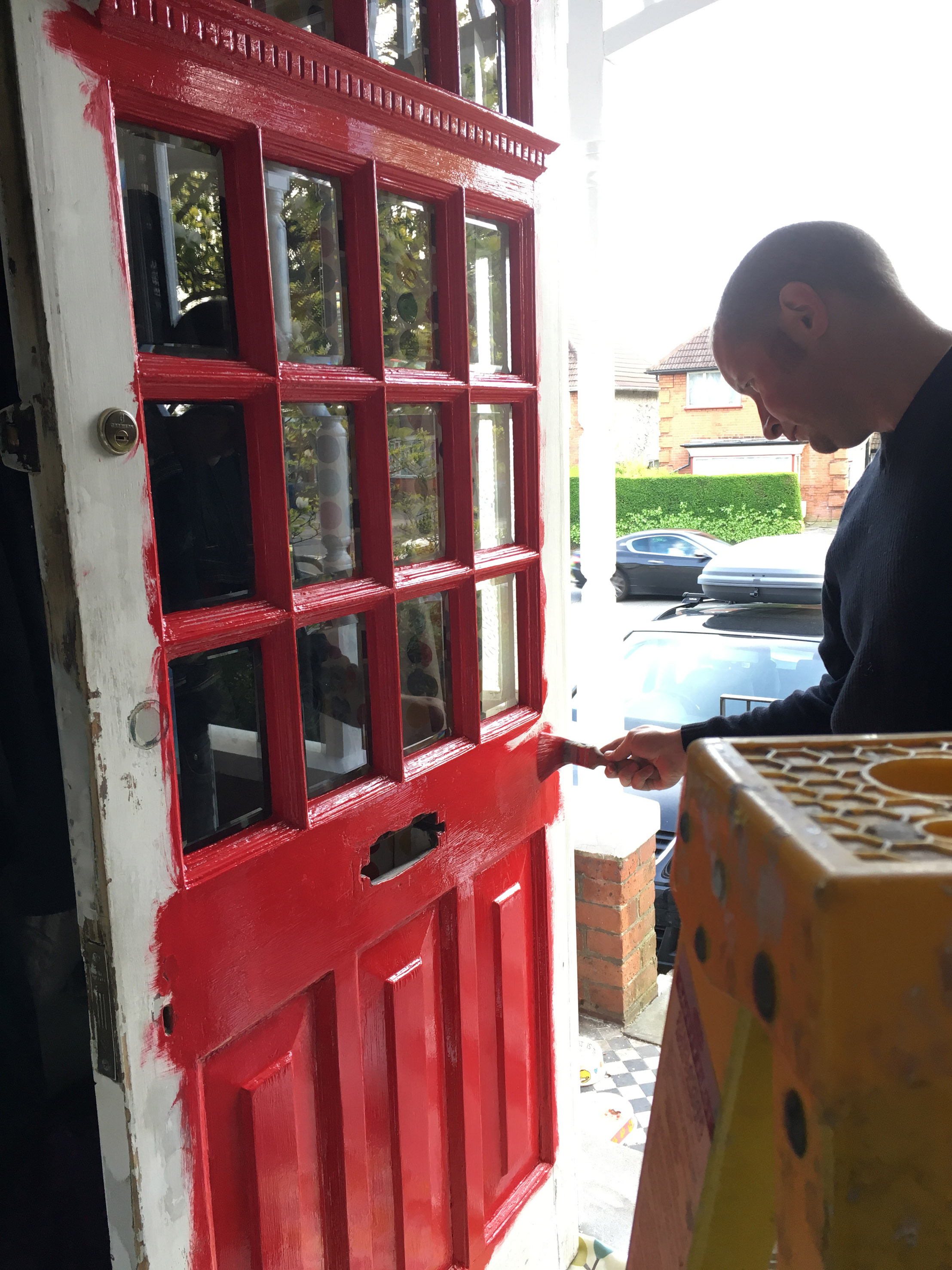 Columnist Richard Burr painting his front door