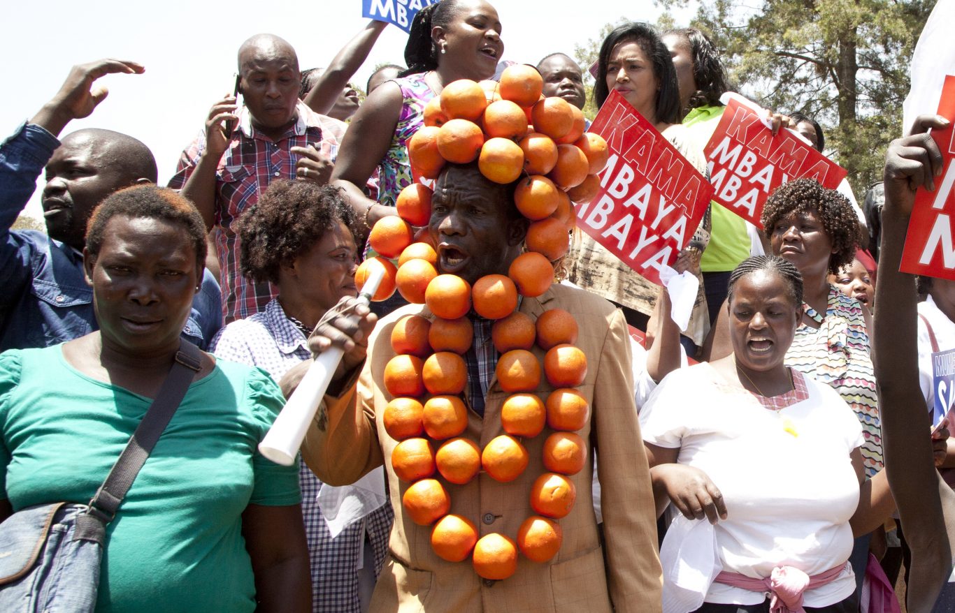 An opposition supporter with oranges, the symbol of the Orange Democratic party march