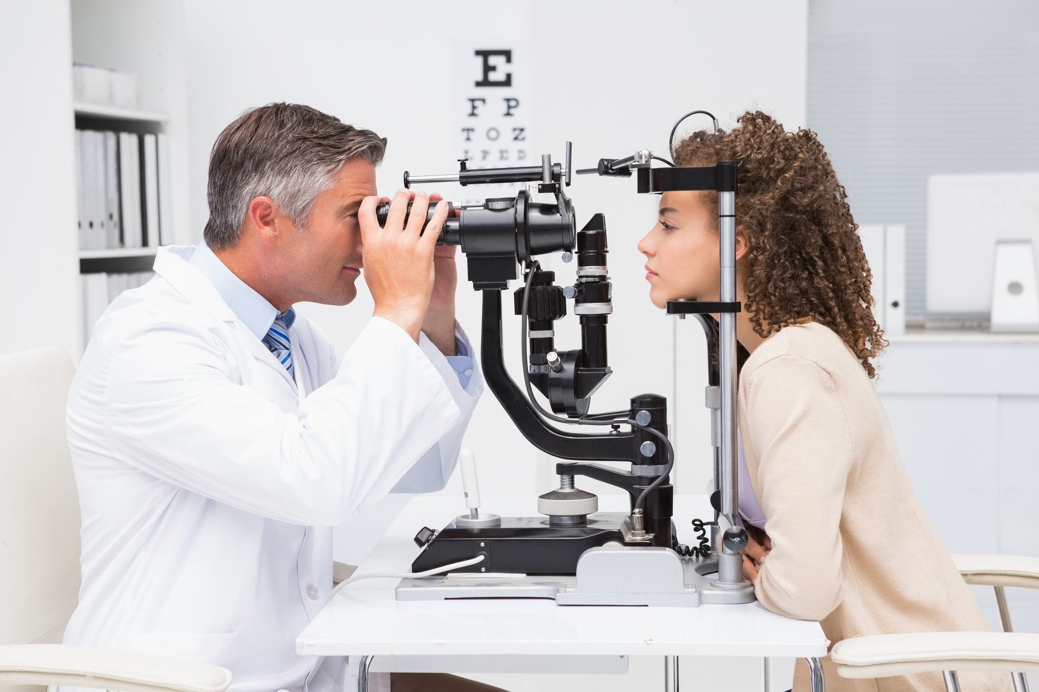 Generic photo of woman doing eye test with optometrist in medical office (Thinkstock/PA)