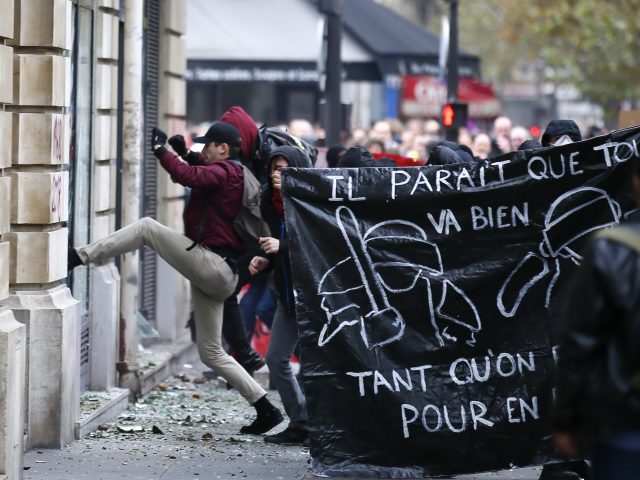 Protesters target a bank in Paris