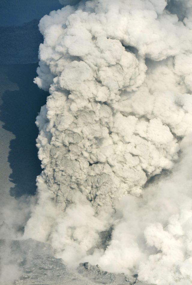 Smoke rises from the  volcano