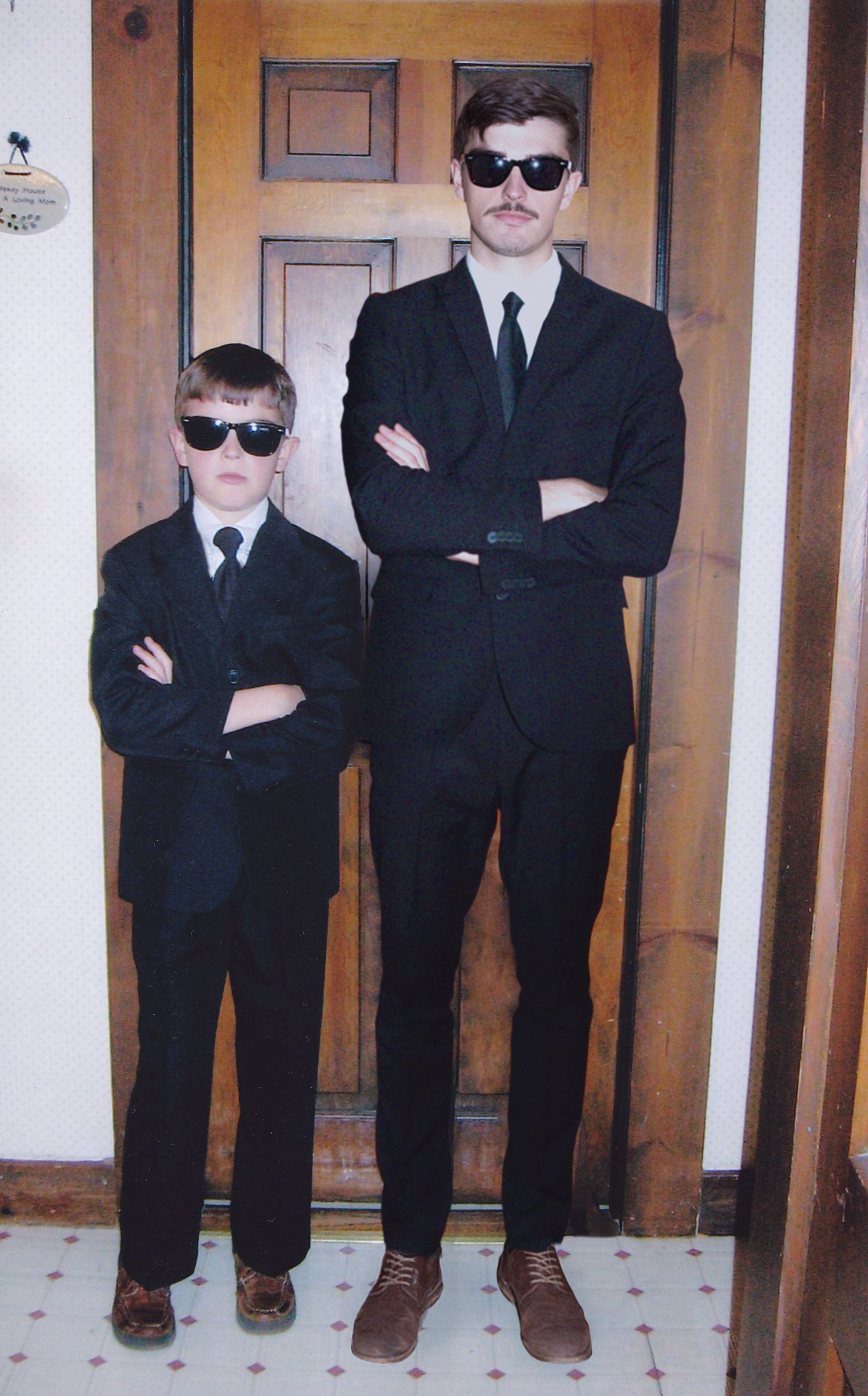 Conor and his younger self in suits with sunglasses (Conor Nickerson)