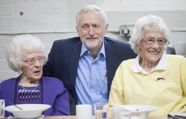 Mr Corbyn helped make a berry crumble at the Kirkgate centre (Danny Lawson/PA)