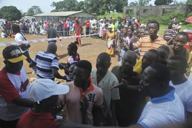 People wait to cast their votes