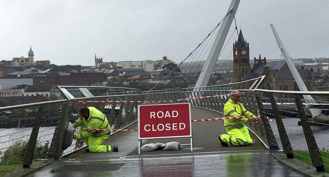 Staff from the Northern Ireland Road Service close the Peace Bridge in Londonderry