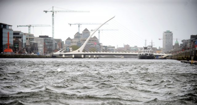 Choppy waters of the River Liffey in front of the Samuel Beckett Bridge in Dublin