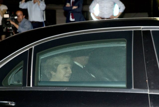 Theresa May leaves after a meeting at EU headquarters in Brussels