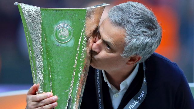 Jose Mourinho kisses the Europa League trophy