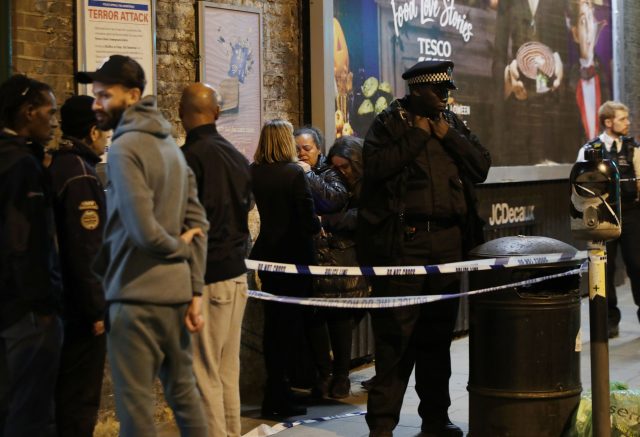 Police at the scene outside Parsons Green Tube station