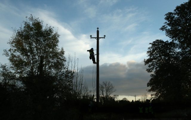 Workers in Kilcock, Ireland, clear fallen power lines after Ophelia batterred the country with gusts of up to 80mph (Niall Carson/PA)