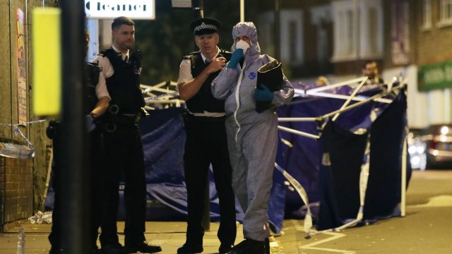 Forensic officers at the scene outside Parsons Green Tube station where Omid Saidy was killed