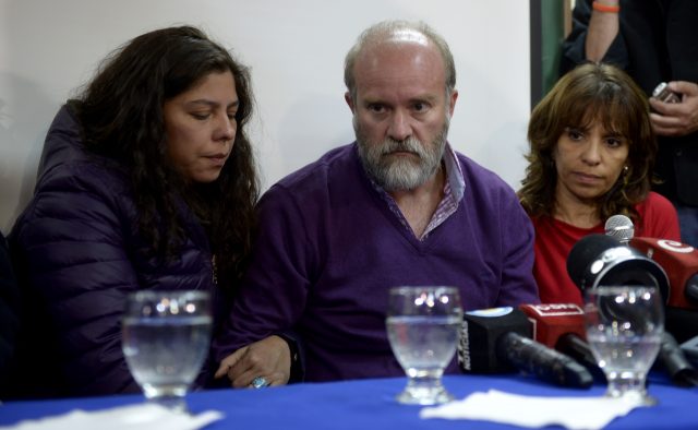 Santiago Maldonado's family lawyer Veronica Heredia, right, Santiago Maldonado's brother Sergio Maldonado, and his partner Andrea Antico attend a press conference in Esquel, Argentina (Natacha Pisarenko/AP)