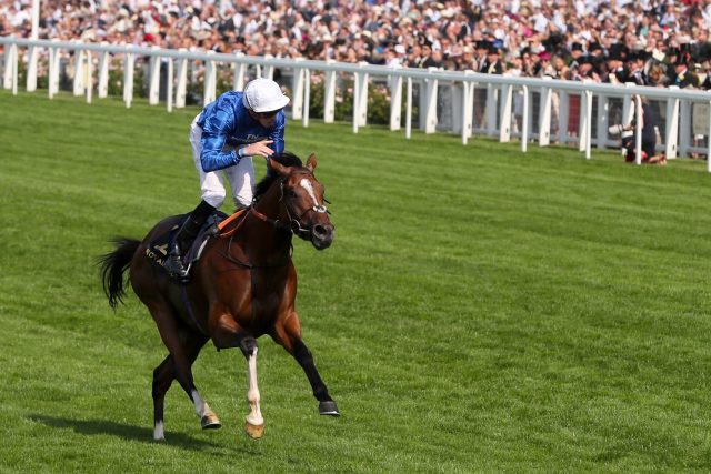 Jockey James Doyle celebrates Barney Roy winning the St James's Palace Stakes