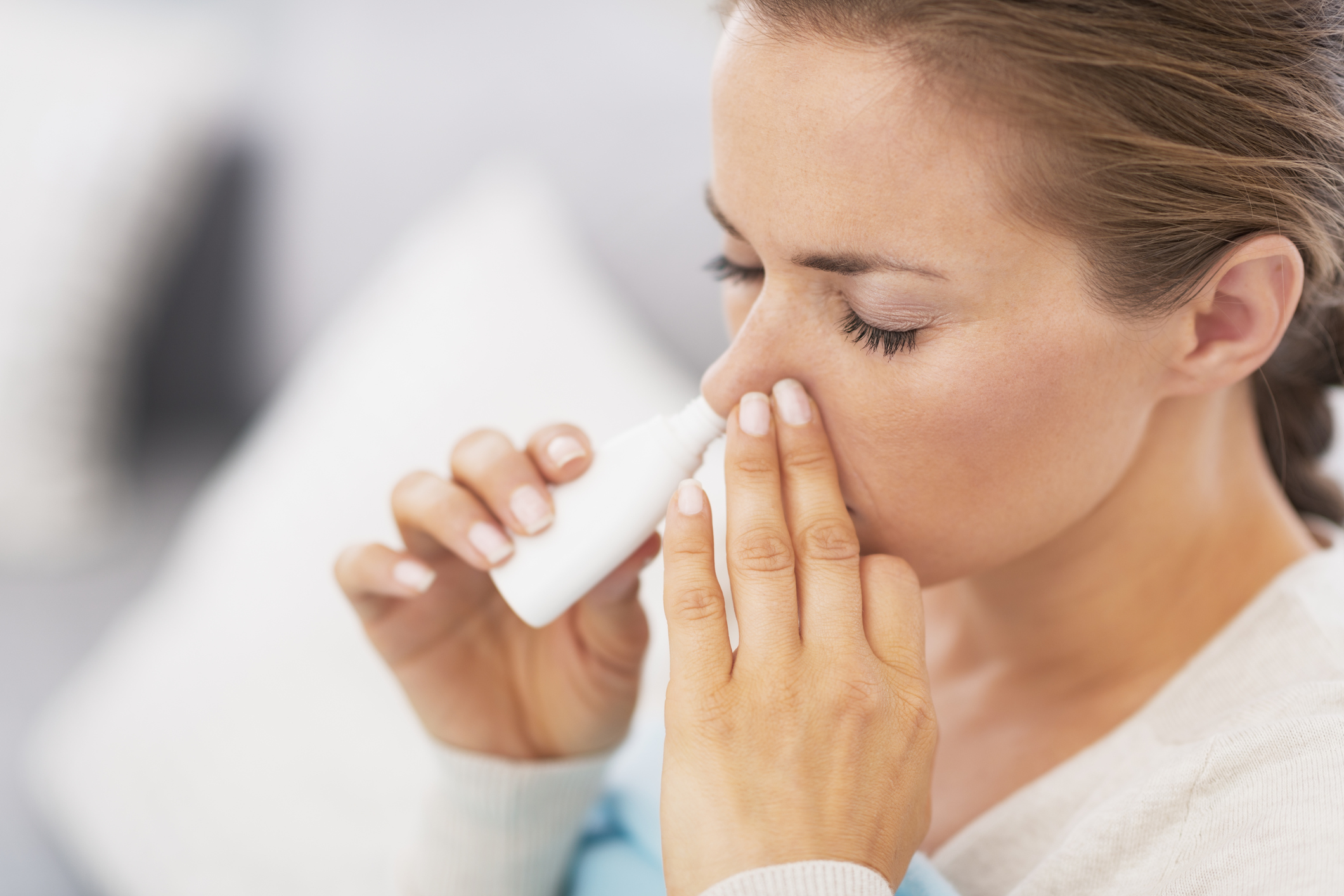 Woman using nasal drops (Thinkstock/PA)