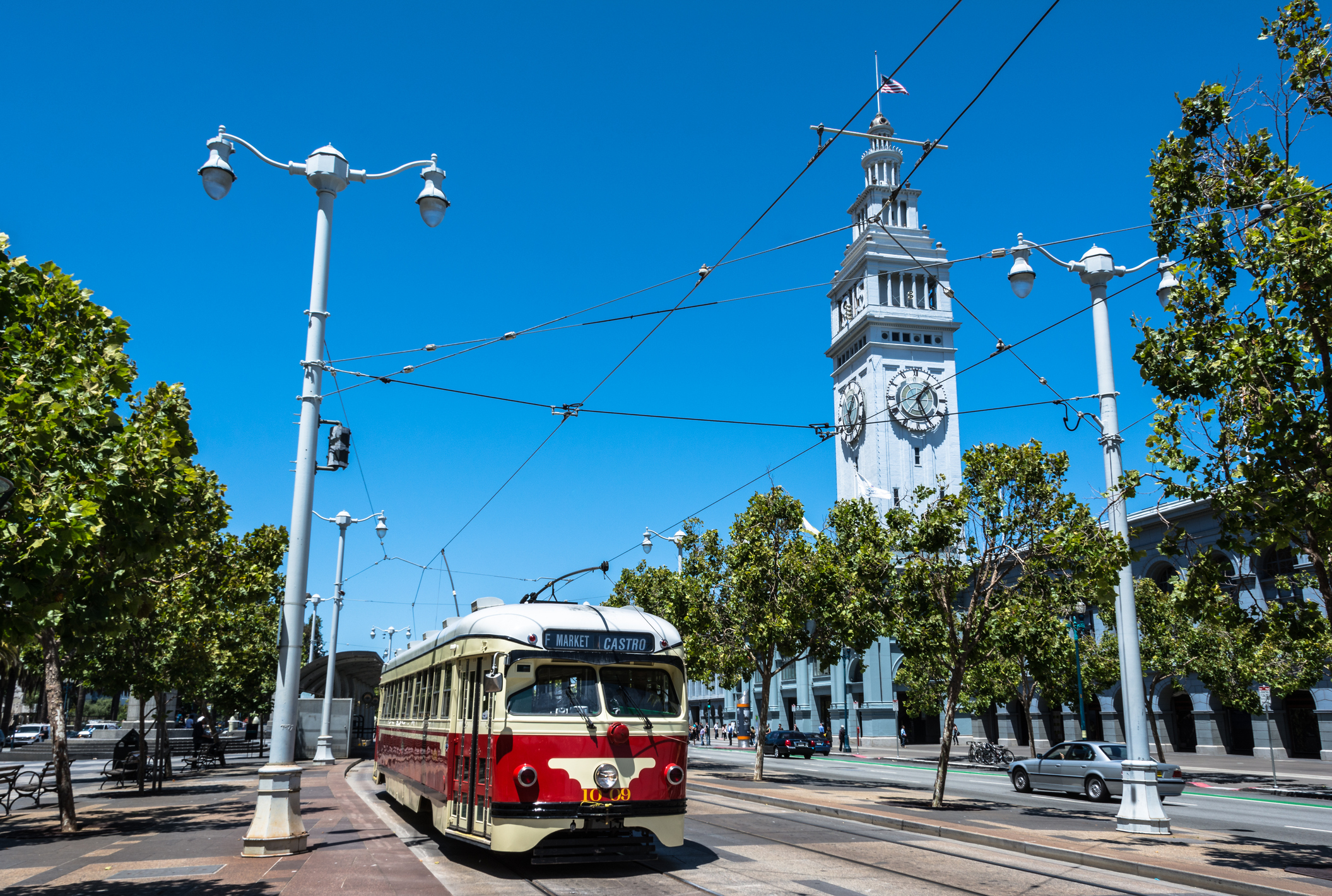 A tram passes in front of the Ferry Building Marketplace in San Francisco (Pikappa/Getty Images)