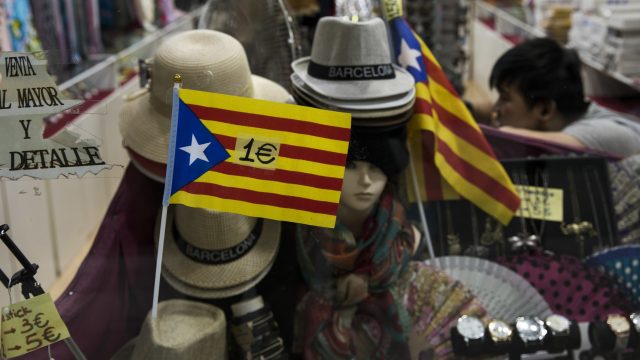 Independence flags are displayed for selling for 1 euro inside a store in downtown Barcelona