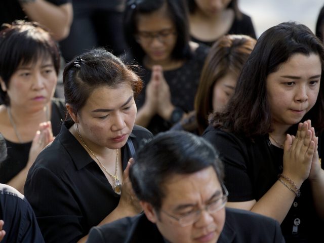 Mourners pay their respects