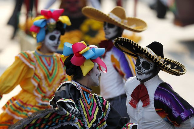 Performers participate in the parade down Reforma Avenue (Eduardo Verdugo/AP)