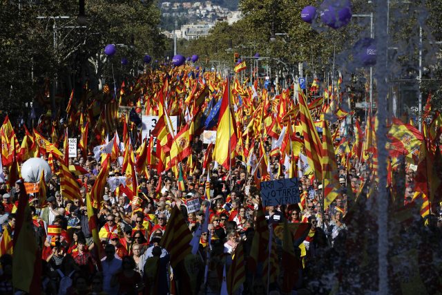 Thousands marched with Catalan, Spanish and European Union flags through Barcelona (Emilio Morenatti/AP)