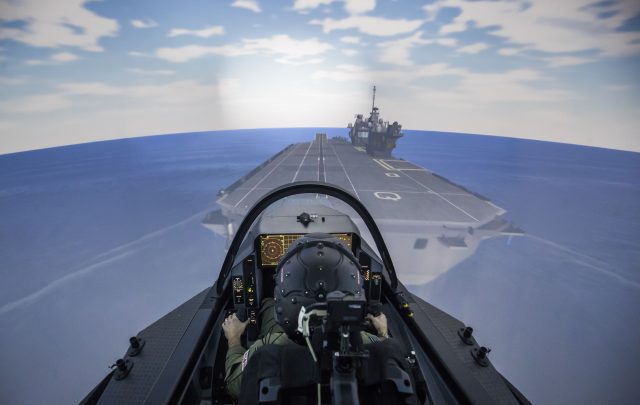 RAF Squadron Leader Andy Edgell, the UK's lead test pilot, uses a specialist fighter jet simulator at BAE Systems in Warton, Lancashire