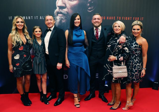 McGregor with his partner Dee Devlin, centre, father Tony, mother Margaret, and sisters Erin, right, and Aoife, left (Brian Lawless/PA Wire)