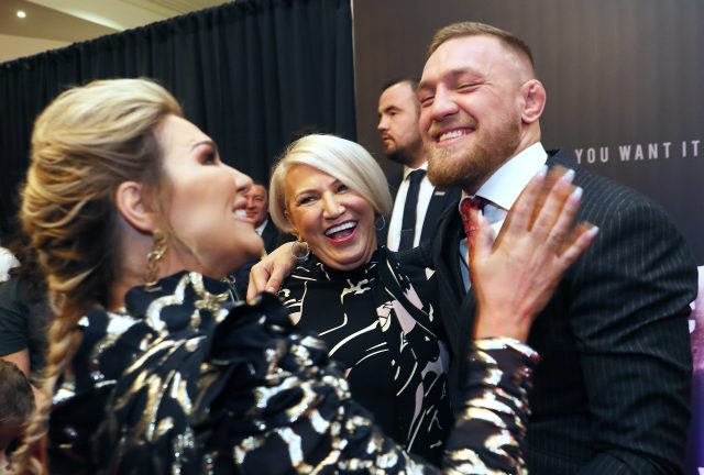 The UFC star with his sister Erin, left, and mother Margaret (Brian Lawless/PA Wire)