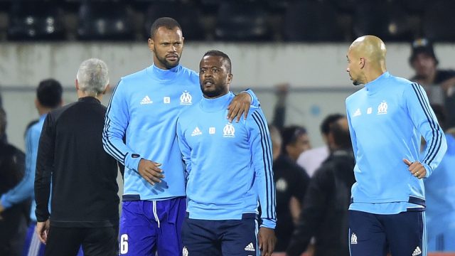 Evra had to be led away by team-mates (Luis Vieira/AP)