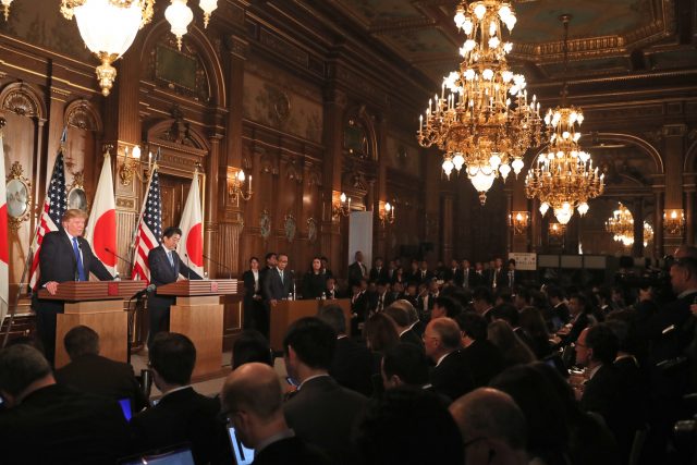 Donald Trump speaks as Shinzo Abe listens during a joint news conference at the Akasaka Palace in Tokyo