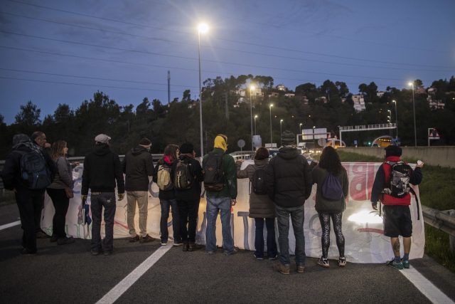 Demonstrators block a highway during the general strike in Barcelona