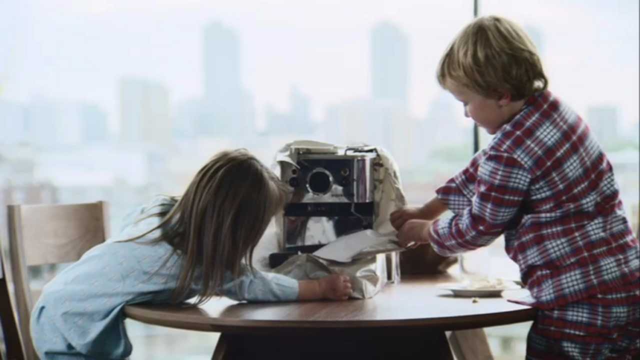 Children opening adult presents in the John Lewis ad - John Lewis/PA
