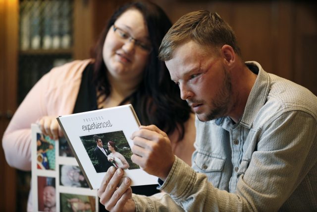 Mrs Ross shared wedding photos with Mr Sandness ( Charlie Neibergall/AP)