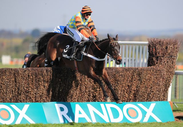 Might Bite and Nico De Boinville jump the final fence at Aintree
