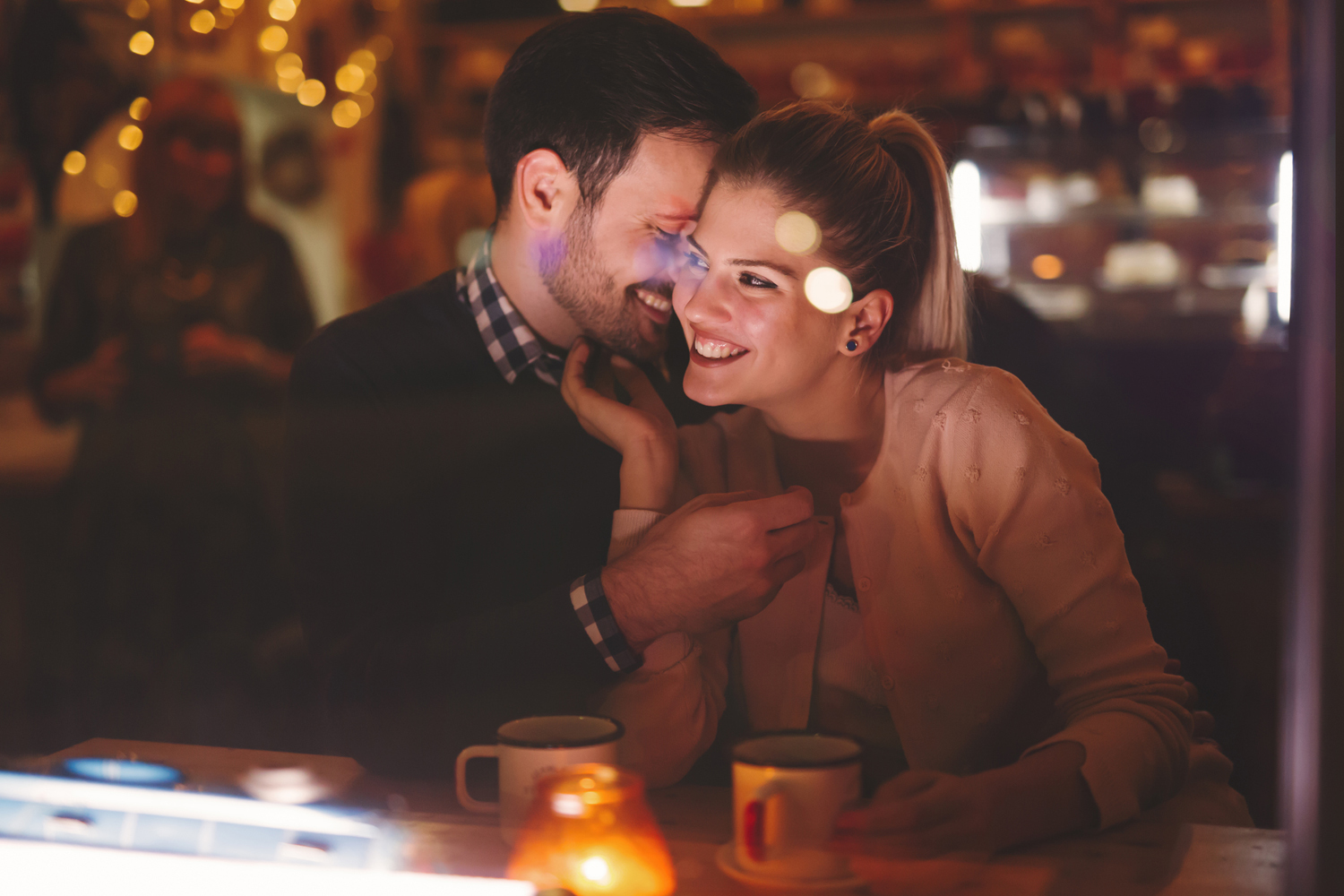 Romantic couple dating at night in pub