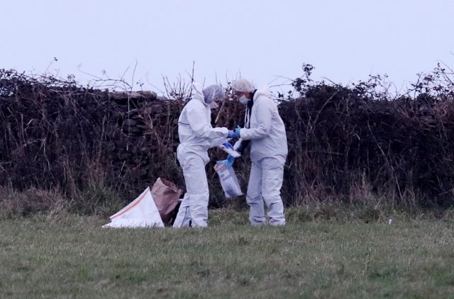 Forensic officers at work on a stretch of coastline near Swanage