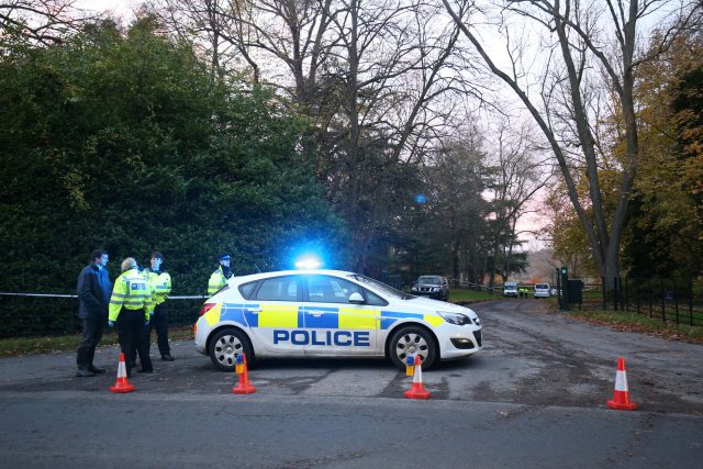 Police at the scene near Waddesdon, in Buckinghamshire, of a mid-air collision between a helicopter and an aircraft 