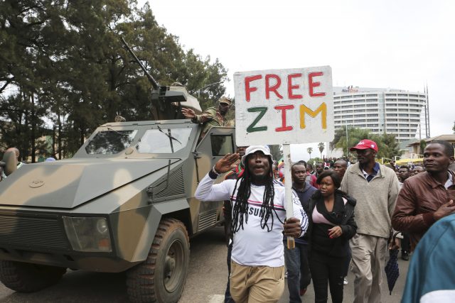 Euphoric crowds march on the streets of Harare 