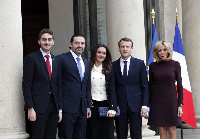 Emmanuel Macron, centre right, and his wife Brigitte, right, greet Saad Hariri, second left, his wife Lara and their son Hussam upon their arrival at the Elysee Palace in Paris 