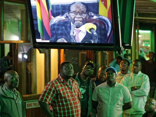 Zimbabweans watch the televised address