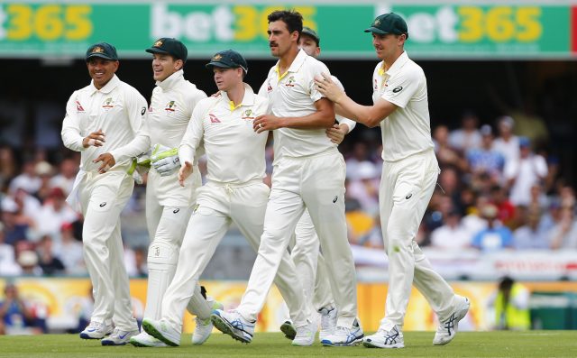 Australia's Mitchell Starc celebrates with team-mates after dismissing England's Dawid Malan 