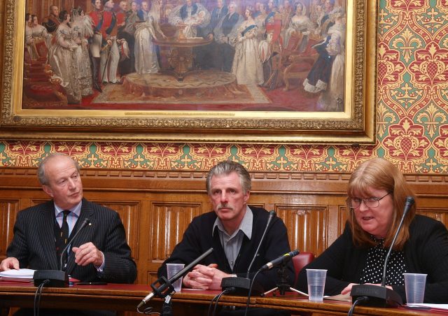 Gilfoyle, with Lord Hunt (left) and his sister Susan Caddick during a press conference after he was released from prison (PA)