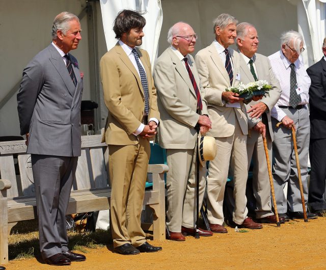 Jim Booth (holding wreath) standing with the Prince of Wales and veterans at a memorial to the Combined Operations Pilotage Parties Memorial Fund heroes (PA)