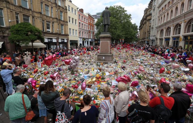 Flowers and tributes left in St Ann's Square in Manchester after the attack (PA)