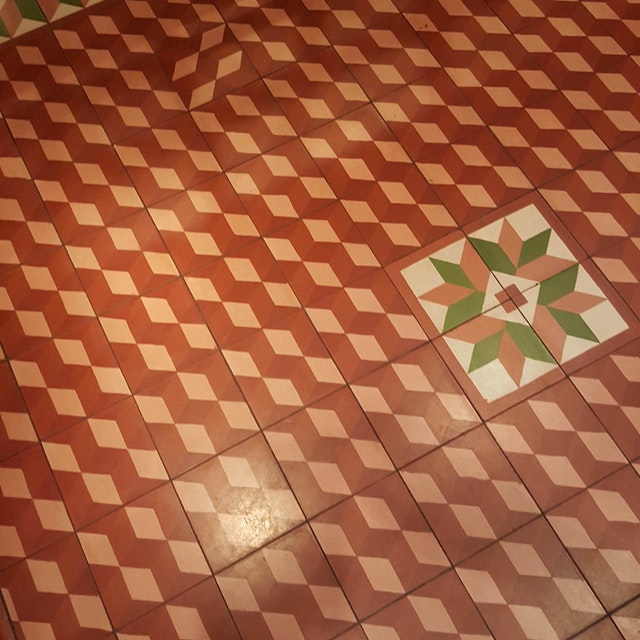 A tiled floor pattern is thrown off by one tile positioned the wrong way around (John Simpson)