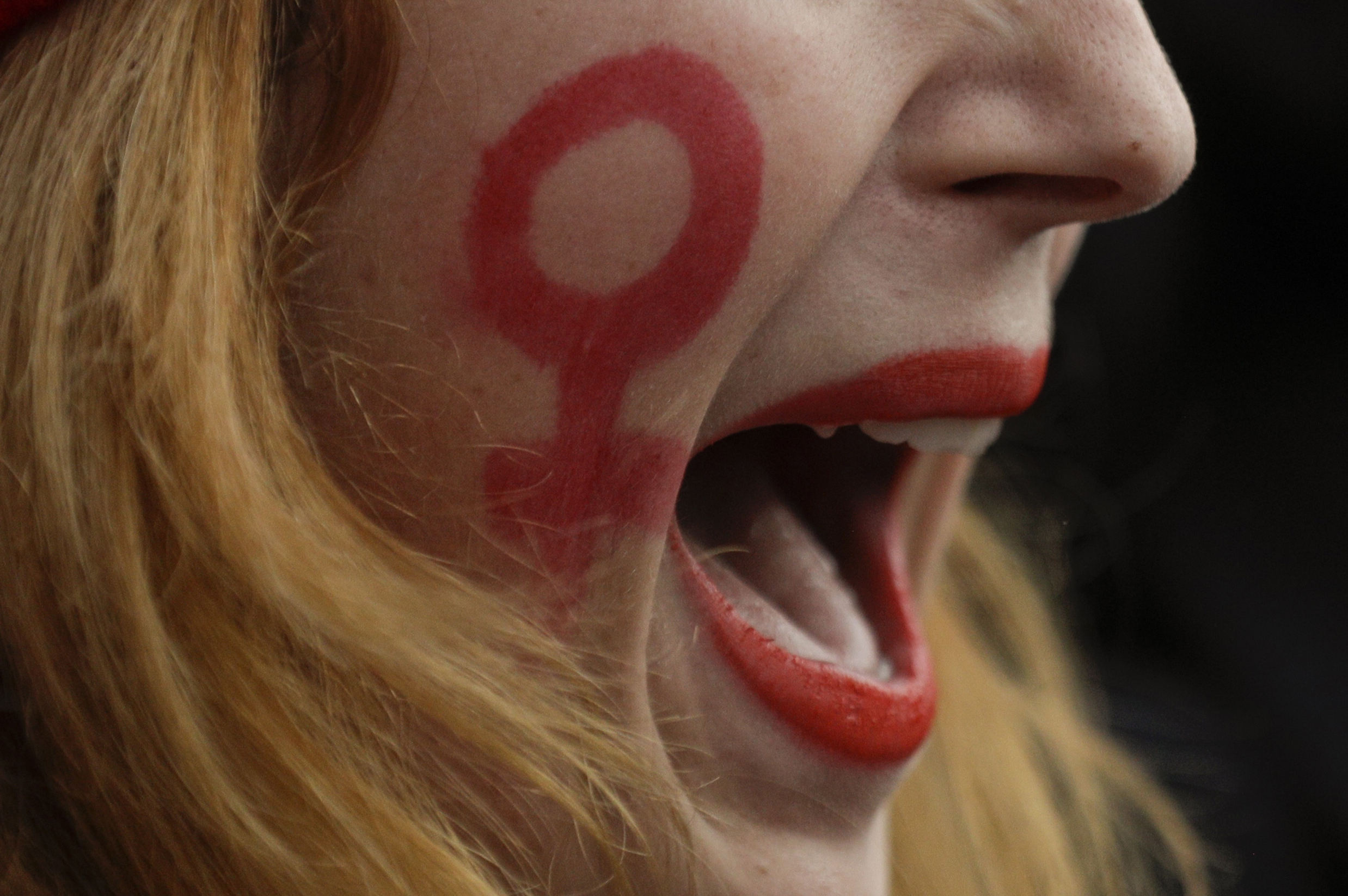 A woman taking part in a march on the International Day for the Elimination of Violence against Women.