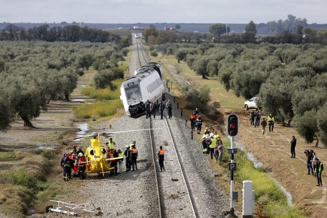 A train carriage is seen derailed near the town of Arahal in Spain