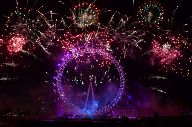 Fireworks light up the sky over the London Eye in central London 