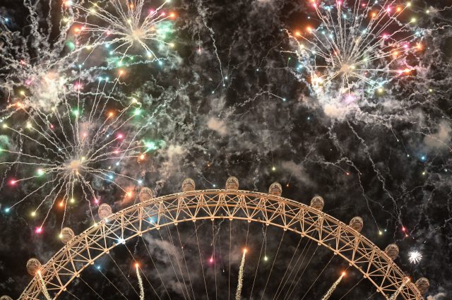 Fireworks light up the sky over the London Eye in central London 
