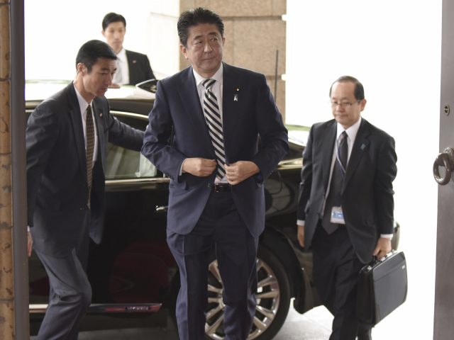 Prime Minister Shinzo Abe arrives at the Imperial Palace to attend a meeting of the Imperial Household Council 