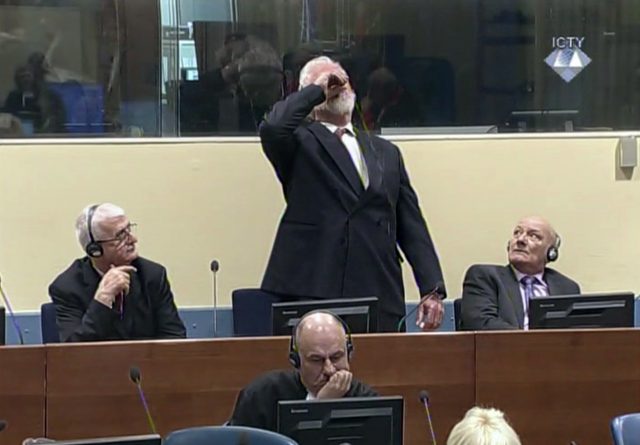 Praljak was seen on video footage bringing the bottle to his lips (ICTY via AP)